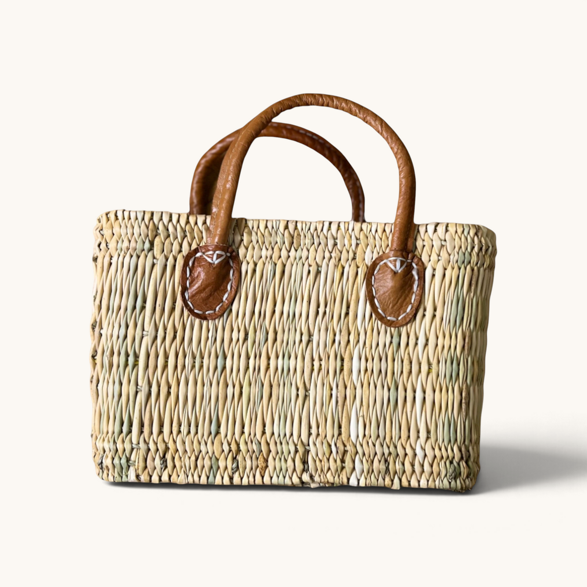tuyya Yasmine structured Moroccan wicker basket with camel leather handles and hand-stitched rivet details