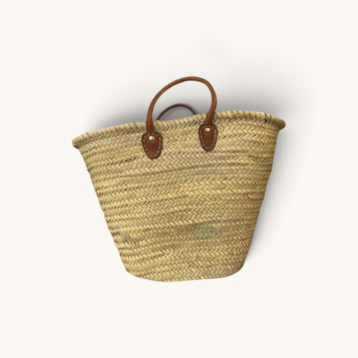 TUYYA Bahia large handwoven Moroccan wicker basket with sturdy brown leather handles and reinforced stitching.